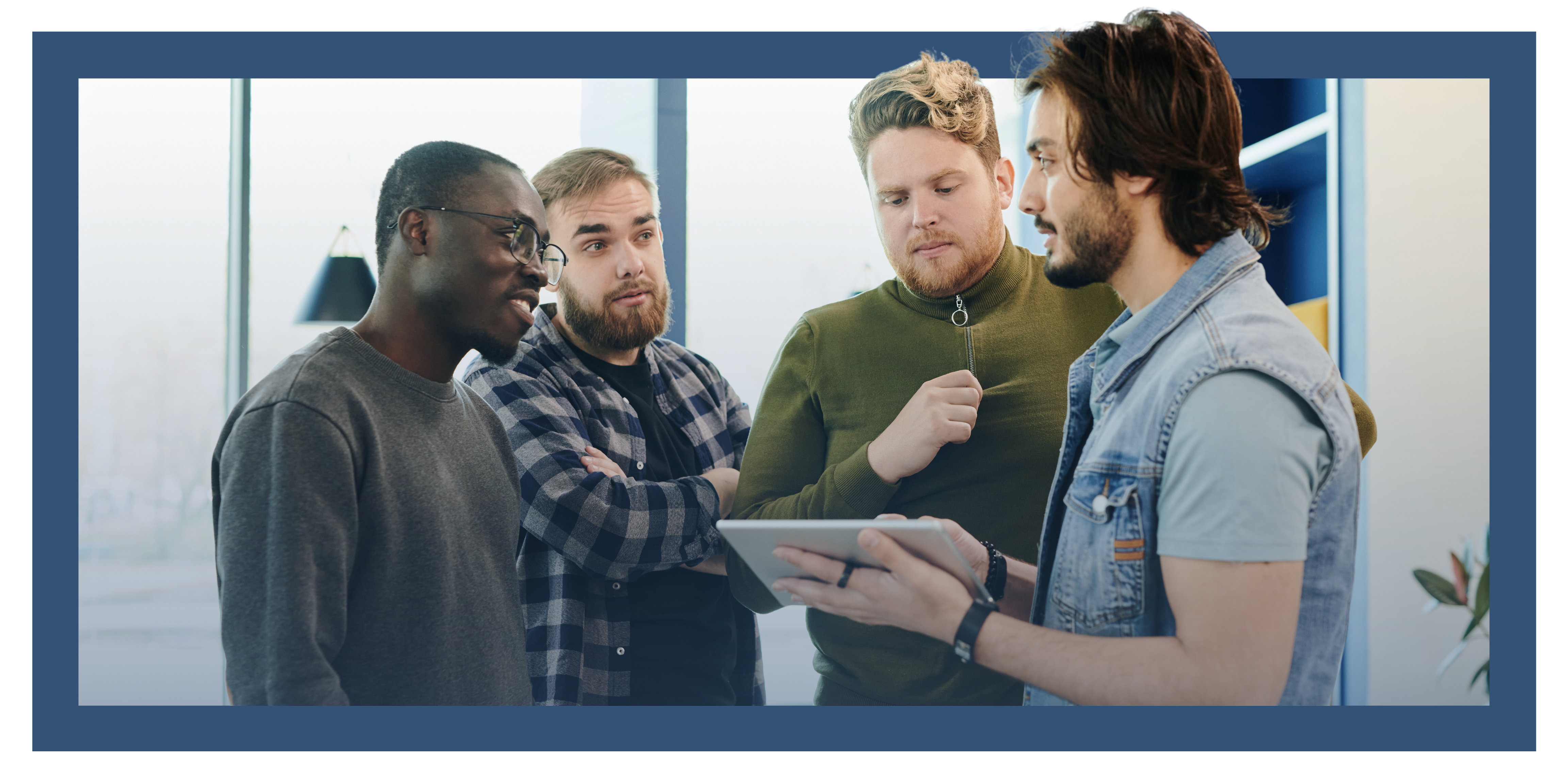 group of people looking at a tablet